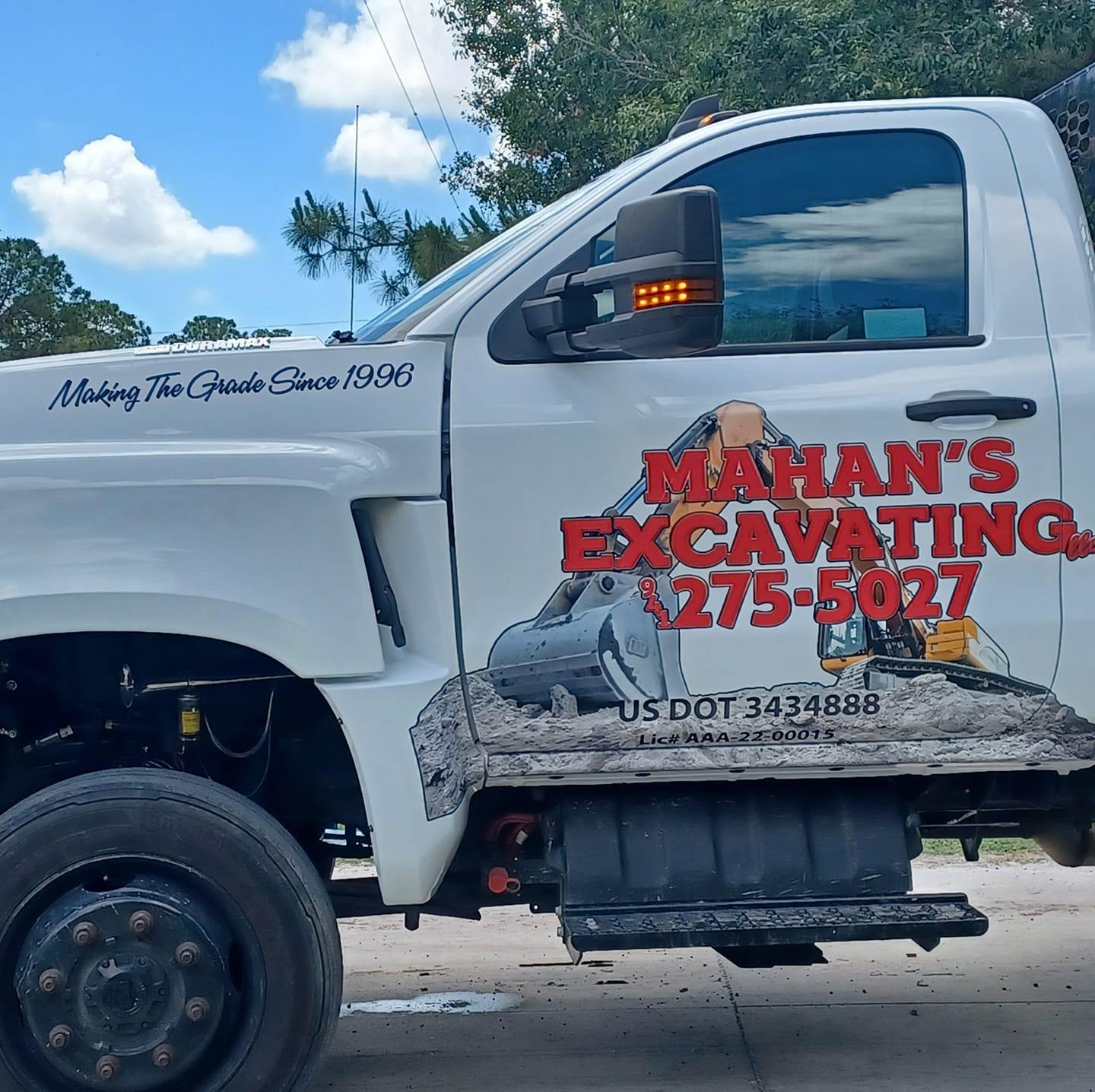 picture of one of the Mahan Excavating pick up trucks with the logo on the door
